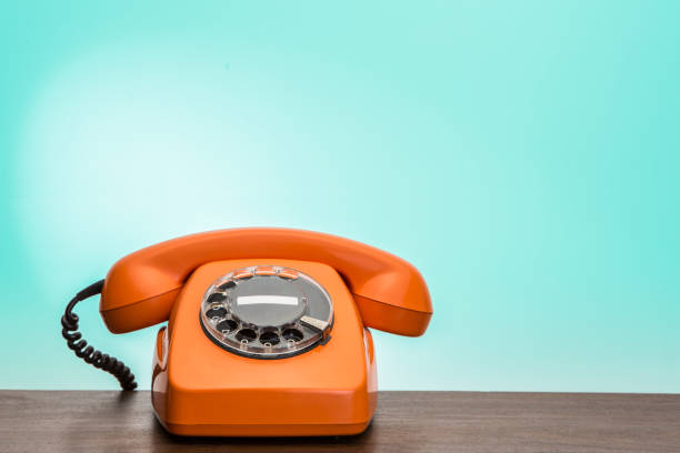 istock Classic orange phone on desk. 935428474