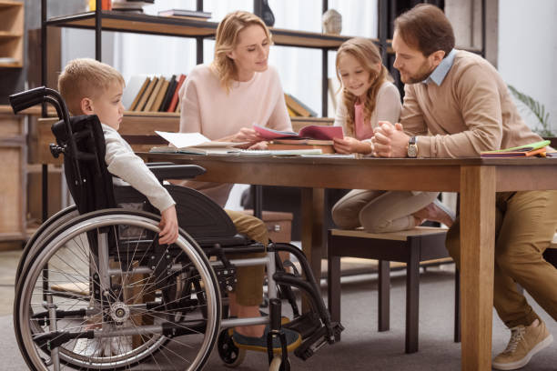 istock happy parents teaching children at home 935428522
