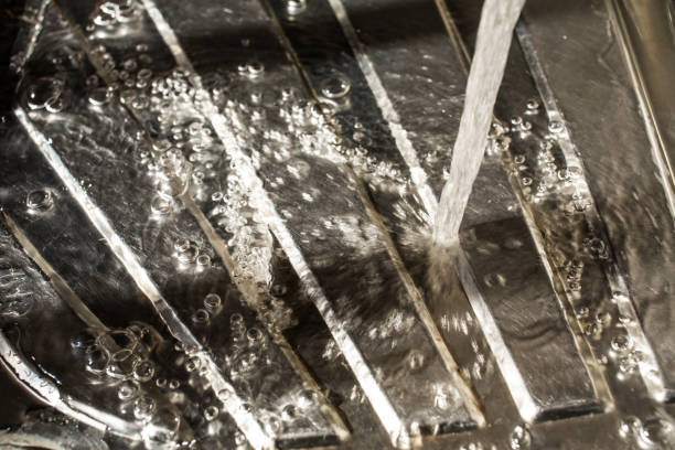 istock Drops of water falling on silver surface, sink in kitchen 935431896