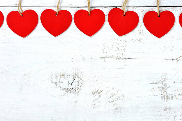 istock hearts on wood - love concept 935433484