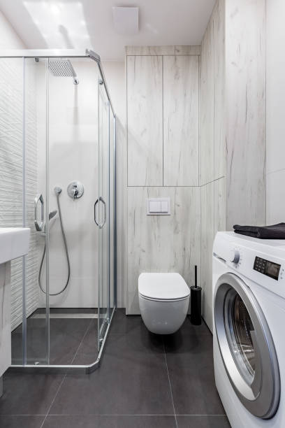 istock Bathroom with washer, shower, toilet 935449512