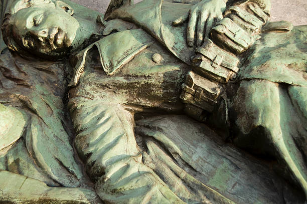 Also known as the tomb of the Unknown Soldier the Tomb of the Unknowns is a monument dedicated to soldiers who have died without their remains were identified.  This Bronze statue was erected in 1923 on the “Heroes’ square” in the small town of Boom (near Antwerp) in Belgium and therefore it is now in the public domain. The portrayed person is a World War I soldier.