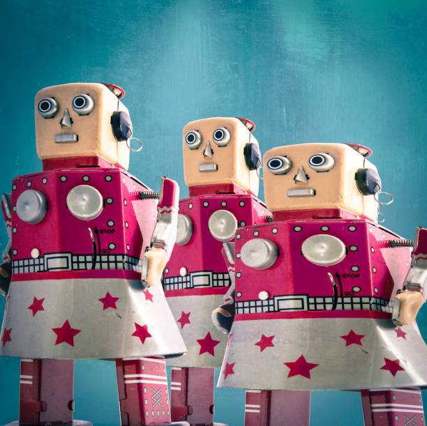 istock three girl robot toys looking forward, 935470906