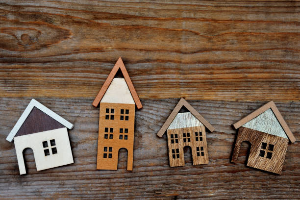 istock house on wooden background 935471354