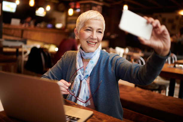 istock Senior woman in coffee shop 935471880