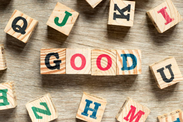 istock Letter block in word good with another on wood background 935472254