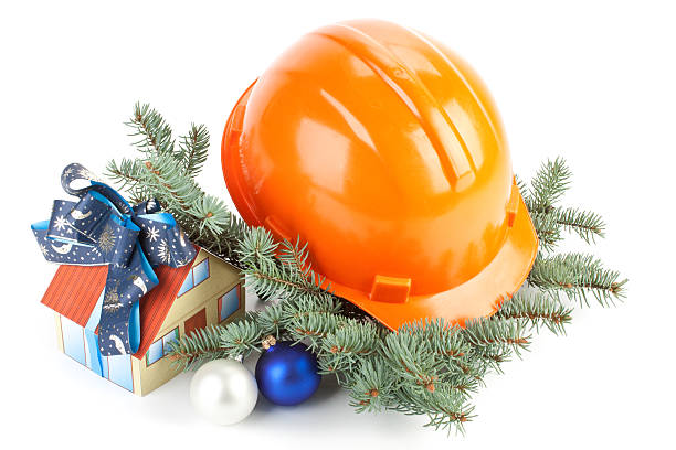 istock Christmas construction idea with helmet and house in wreath 93547512