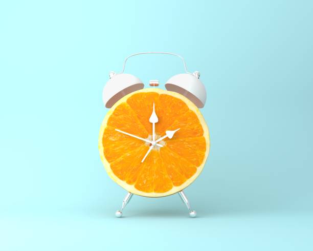 istock Creative idea layout fresh orange slice alarm clock on pastel blue background. minimal idea business concept. fruit idea creative to produce work within an advertising marketing communications 935476608