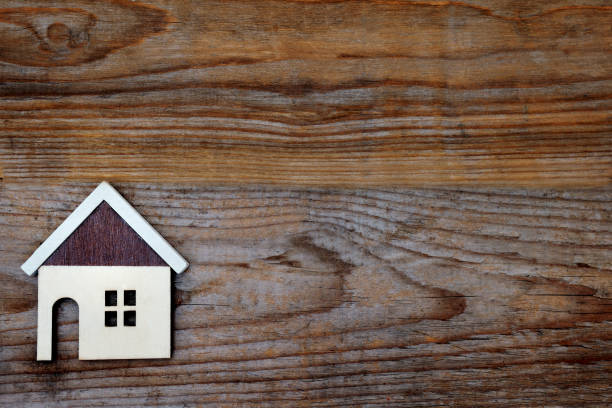 istock house on wood background 935476872