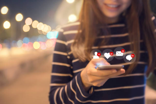 istock Happy woman hands using mobile smartphone with icon social media and social network. 935483012