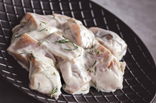 istock Pickled herring in cream sauce with dill. 935483382