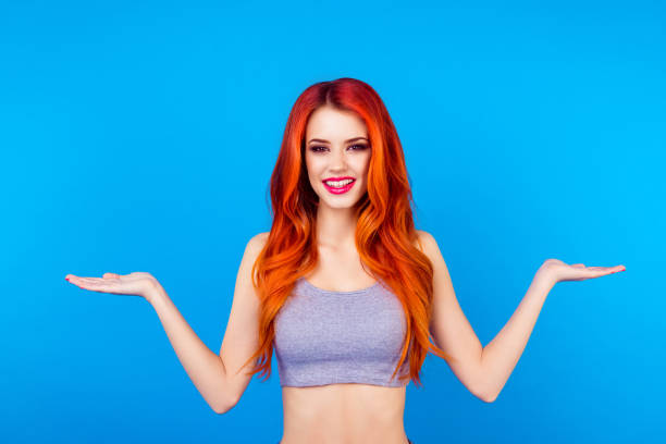 istock Pretty slender woman showing something with her hands 935484276
