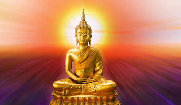 istock Buddha statue with aura on red background 935488156