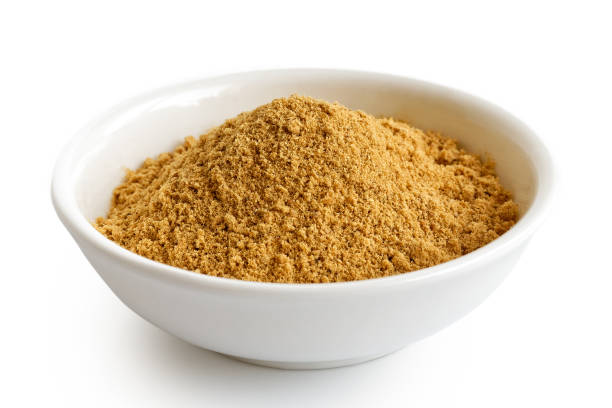 istock Finely ground dry ginger in white ceramic bowl isolated on white. 935488240