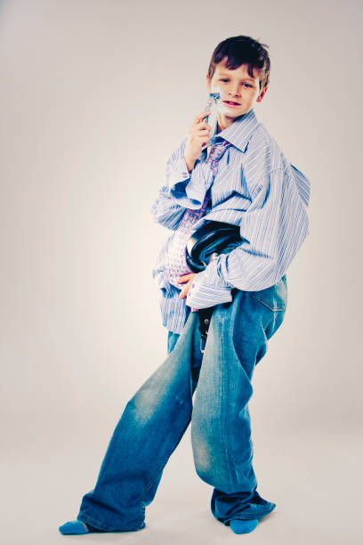 istock funny boy wearing Dad's clothes 935488858