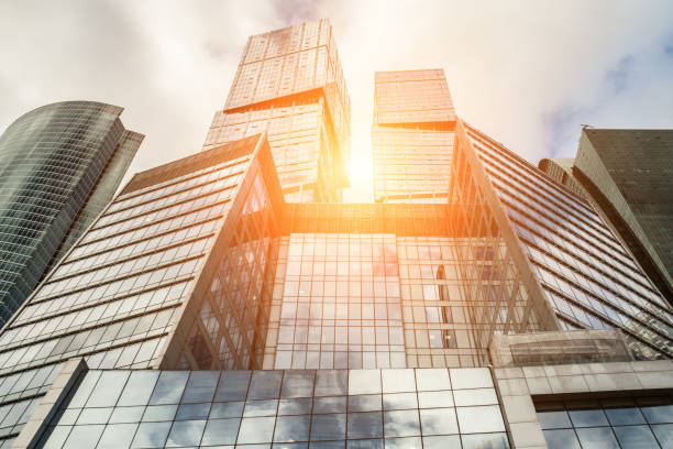istock Detail blue glass building background with cloud sky 935489126
