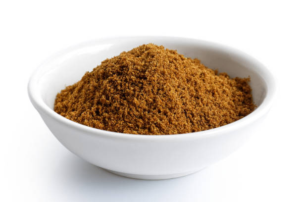 istock Ground cumin in white ceramic bowl isolated on white. 935493424