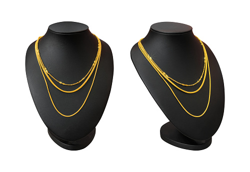 Necklace display stand with gold necklace isolated on white background. Part of top blank mannequin. ( Clipping path )