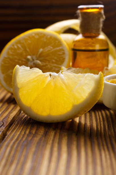 istock Lemon essential oil on a wooden background 935506184