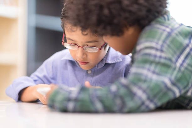 istock Little boys watching Phone. 935506826