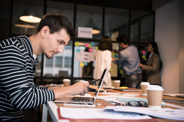 istock Serious businessman is working with laptop. 935507056