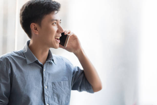 istock Cheerful businessman is talking with someone. 935507084