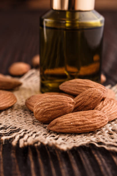 istock almond essential oil on a wooden background 935507230