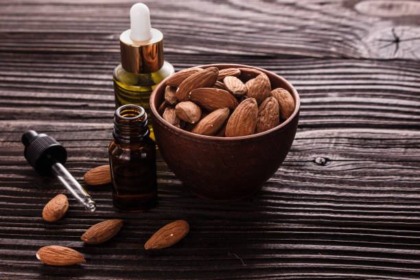 istock almond essential oil on a wooden background 935511624