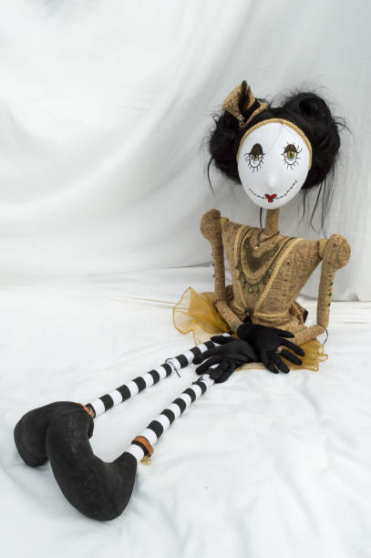istock Creepy steampunk doll sitting with legs outstretched. Vertical. 935511764
