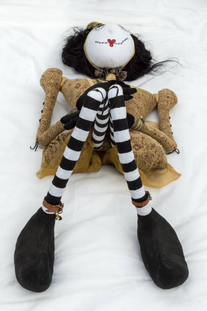 istock Creepy steampunk doll lying on back knees raised. Vertical. 935511958