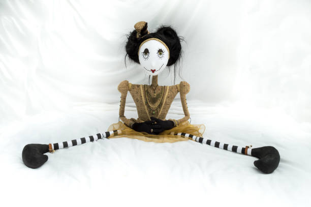 istock Creepy steampunk doll sitting with legs wide apart. 935512236