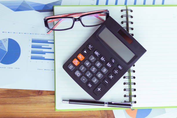 istock Top view of the businessman's work, calculator placed on the table. 935512282