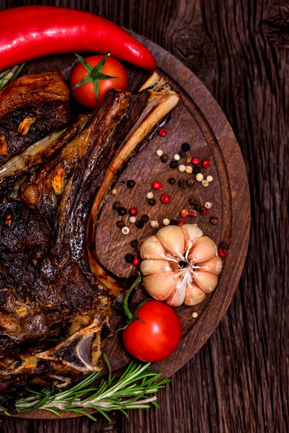 istock Tasty beef steak with spices and vegetables close 935523916