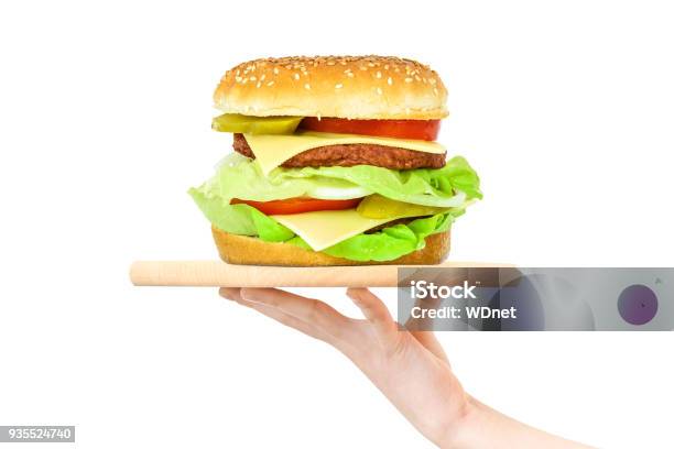 Hamburger On A Wooden Tray Stock Photo - Download Image Now - Burger, Holding, One Person