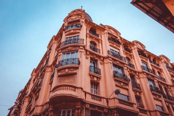 istock historical and red facaded corner building from the low angle view 935537678