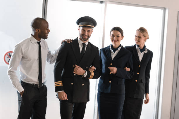 istock happy aviation personnel team in professional uniform 935538498