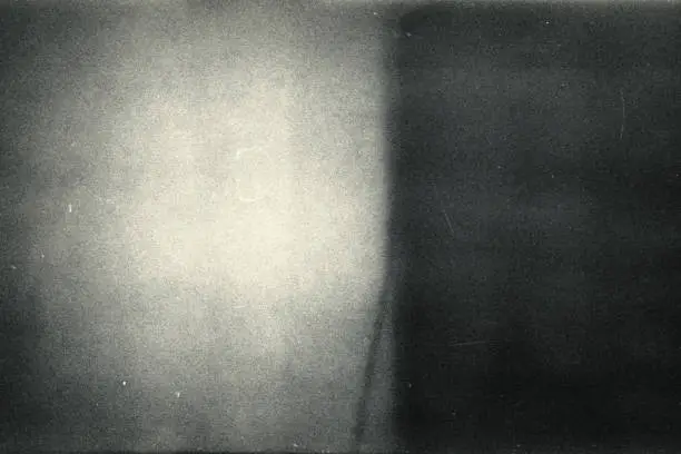 Photo of Noisy film frame with heavy scratches, dust and grain