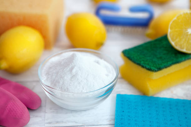 istock Baking soda, lemon and cleaning accessories 935539632