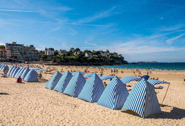 Beach in with striped tents Dinard, Brittany, France stock photo