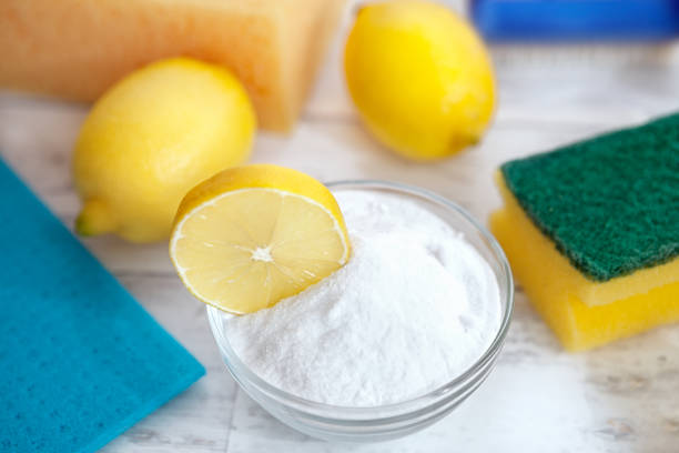 istock Baking soda, lemon, sponge and dishtowel 935542224