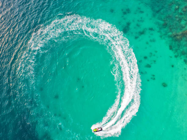 istock People are playing jet ski at sea during the holidays. 935542310