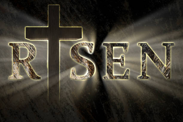 istock Easter background with Jesus Christ cross and risen text written, engraved, carved on stone, 935543368
