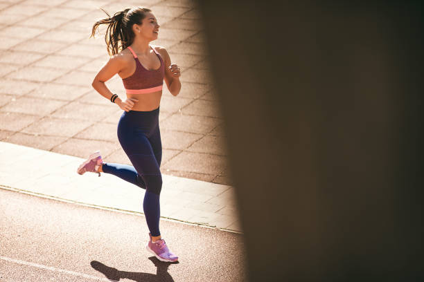 istock Portrait of woman running. 935551900