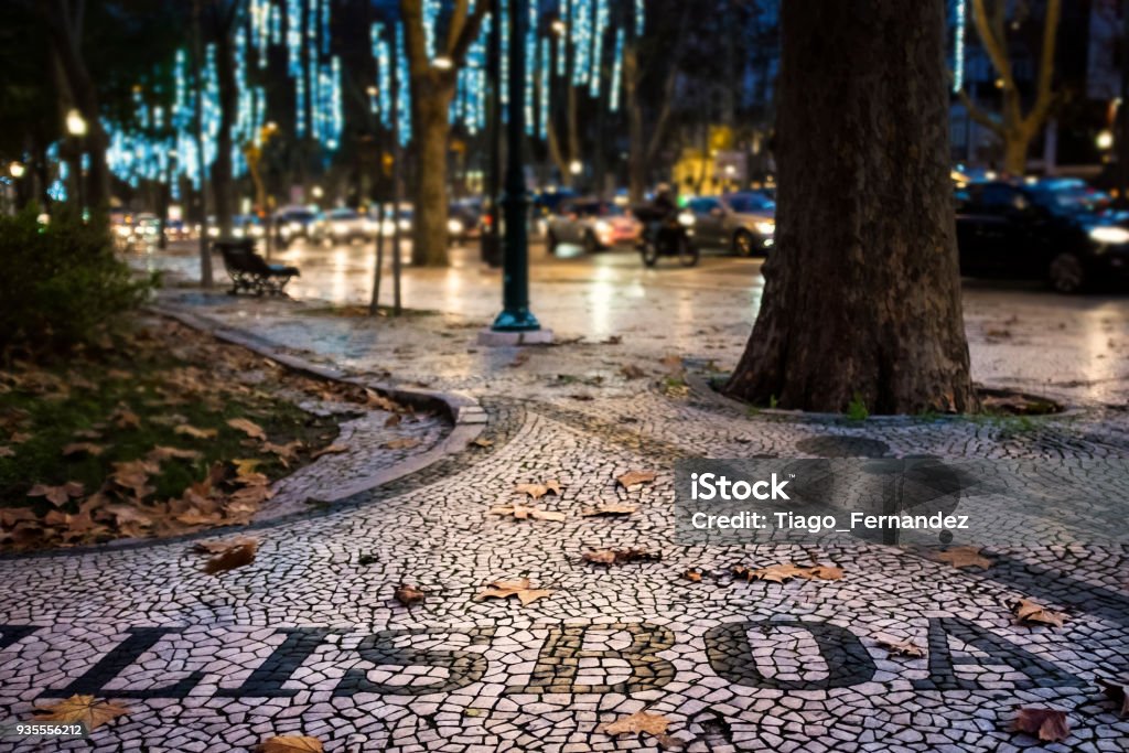 Detail of the beautiful Portuguese pavement at the Liberdade Avenue in the city of Lisbon, Portugal, with dry leaves Detail of the beautiful Portuguese pavement at the Liberdade Avenue in the city of Lisbon, Portugal, with dry leaves; Concept for visit Lisbon in fall and welcome Lisbon Lisbon - Portugal Stock Photo