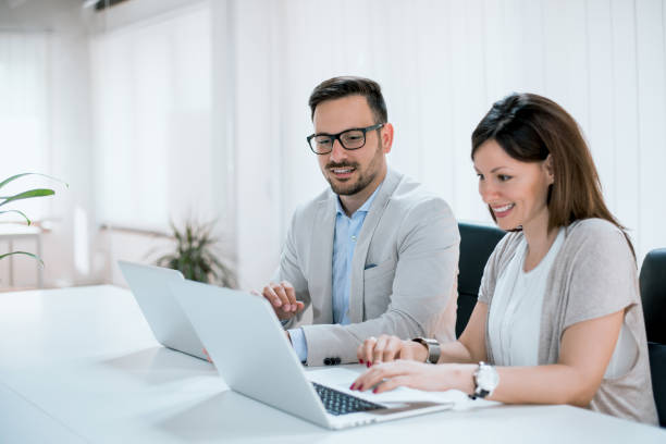 istock A business team of two in office and planning work 935566166