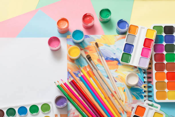 istock paints, pencils and brushes on paper 935567222