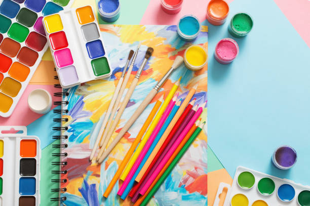 istock paints, pencils and brushes on paper 935567224