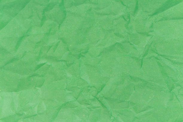 istock green crumpled paper texture background 935573522