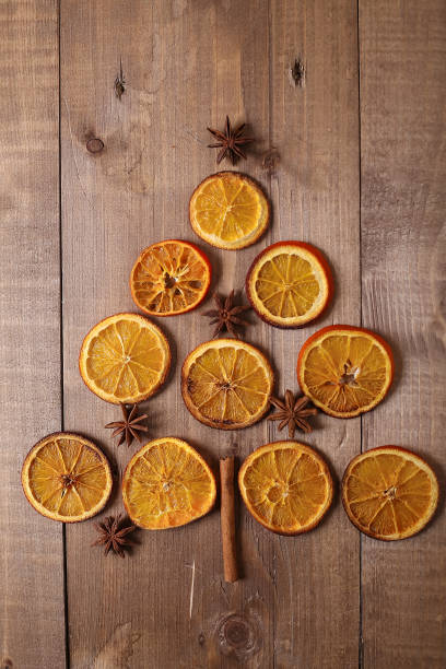 istock Dry slices of oranges lying on the table. Decorative ornament. C 935574476