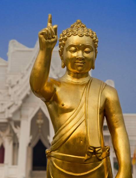 Golden Little Buddha Statue , Nepal At Wat Thai Lumbini Temple , Nepal lumbini nepal stock pictures, royalty-free photos & images